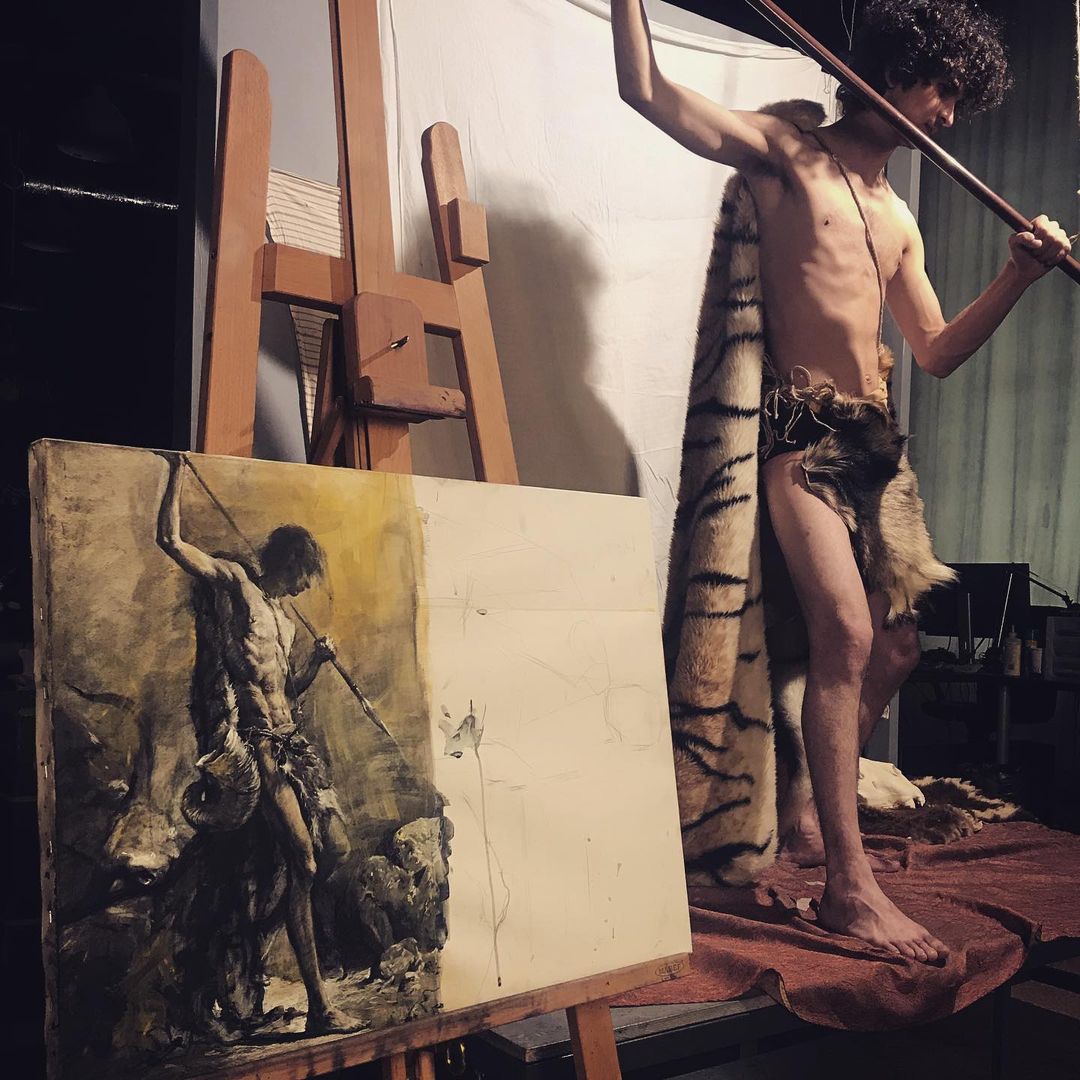 The same session - the model in front, the canvas halfway done behind.